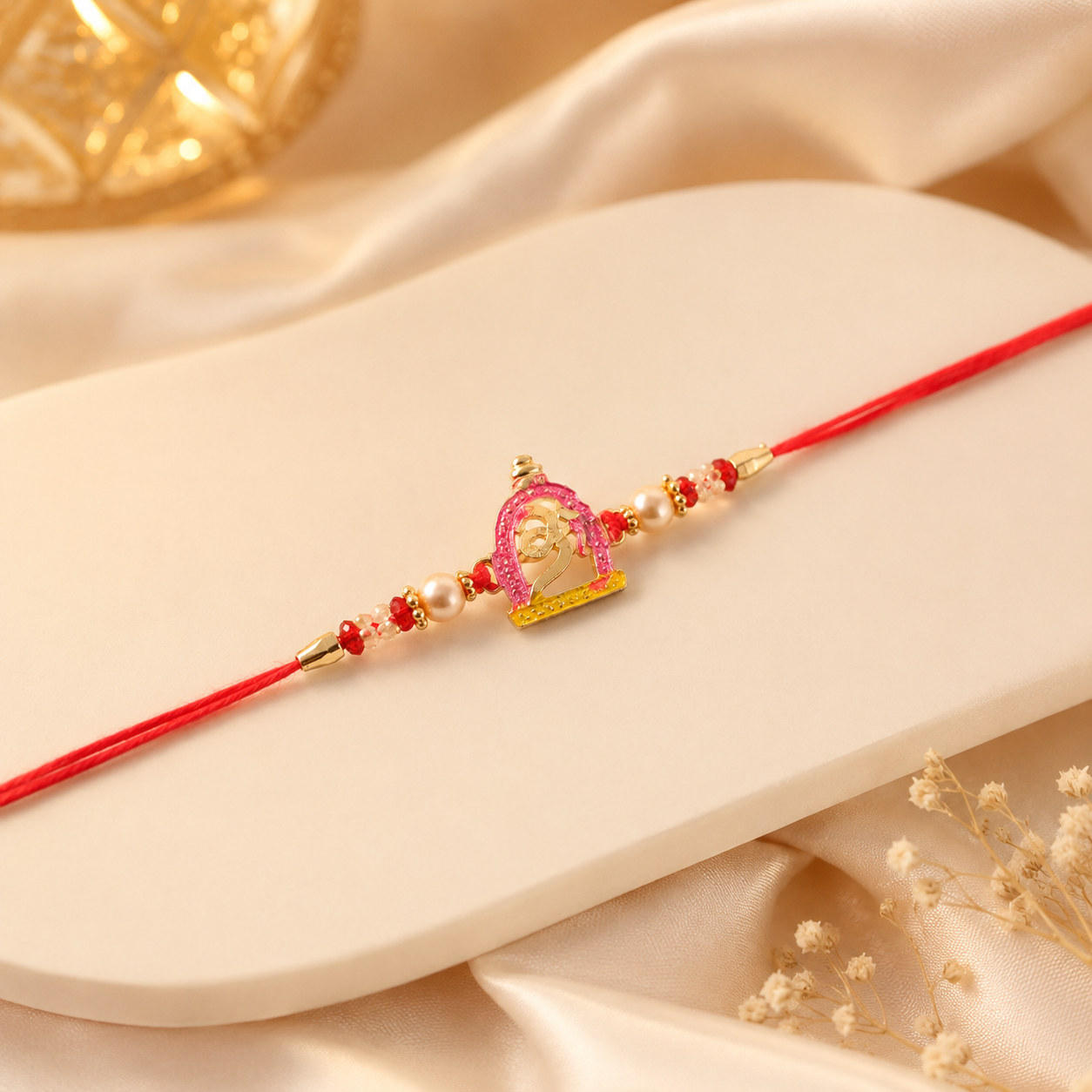 Petite Pink Meenakari Idol Rakhi with Pearl Beads
