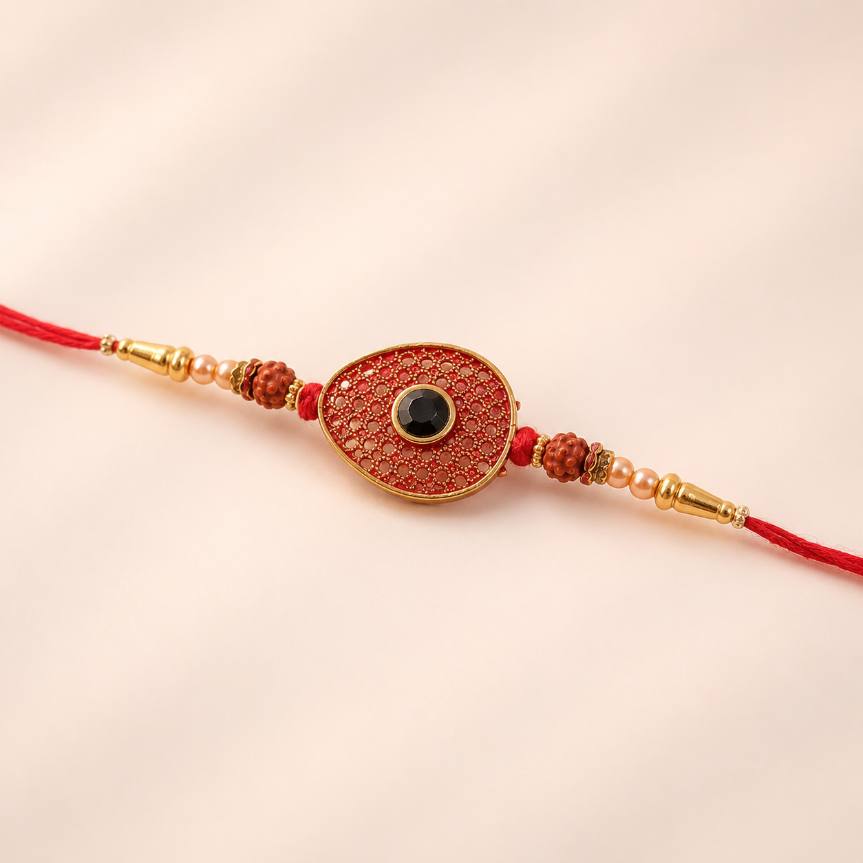 Red Meenakari Oval Disc Rakhi with Rudraksha & Pearls