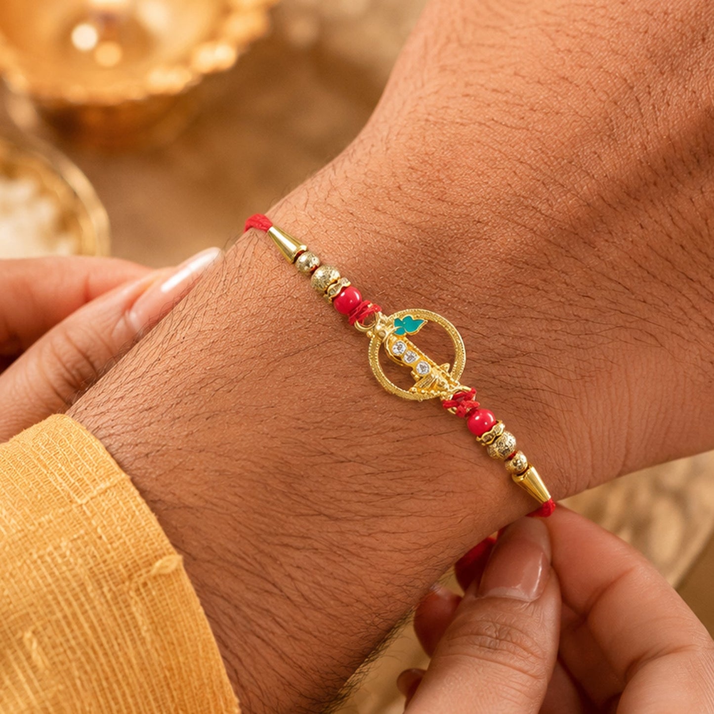 Golden Peacock Ring Rakhi with Kundan & Red Beads