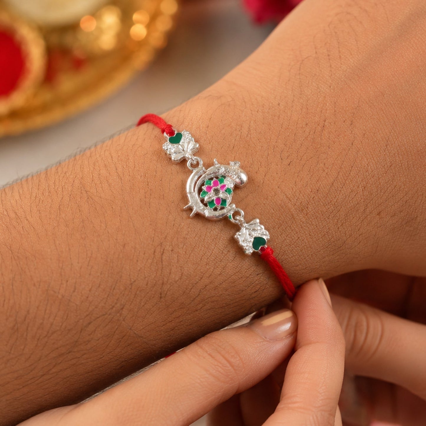 Silver Peacock Meenakari Rakhi with Green & Pink Enamel