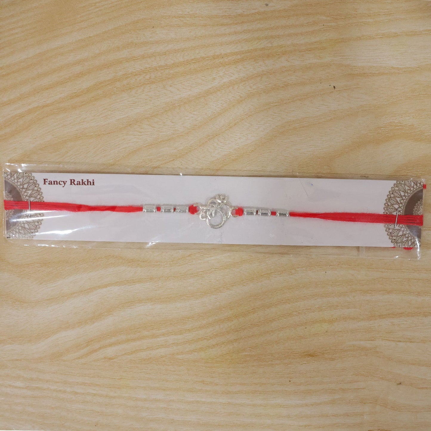 Silver Om (?) Rakhi with Textured Beads