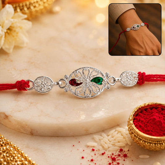 Silver Filigree Rakhi with Red & Green Teardrop Stones
