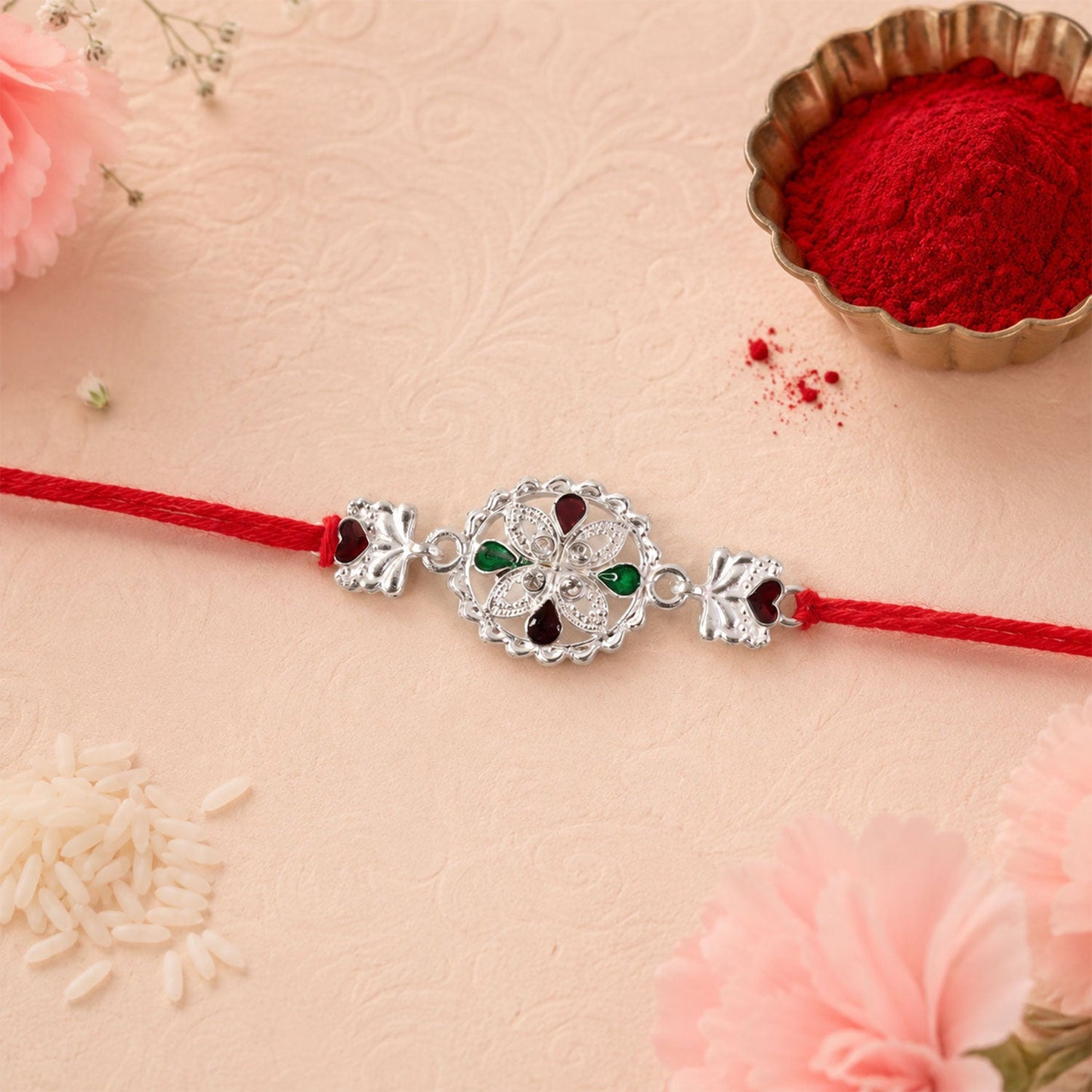 Silver Floral Rakhi with Red & Green Teardrop Stones