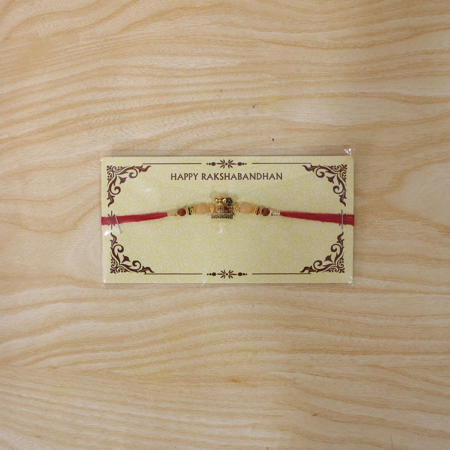 Antique Golden Shivling Rakhi with Beads for Brother