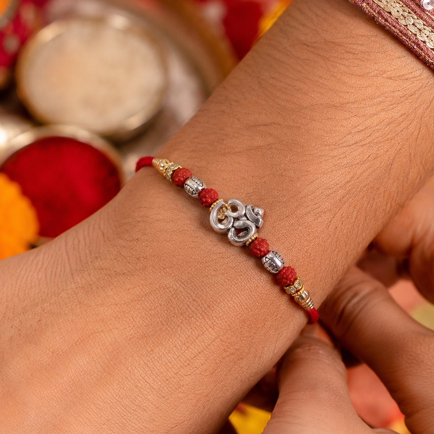 Sacred Silver Om Rakhi with Rudraksha Beads for Brother