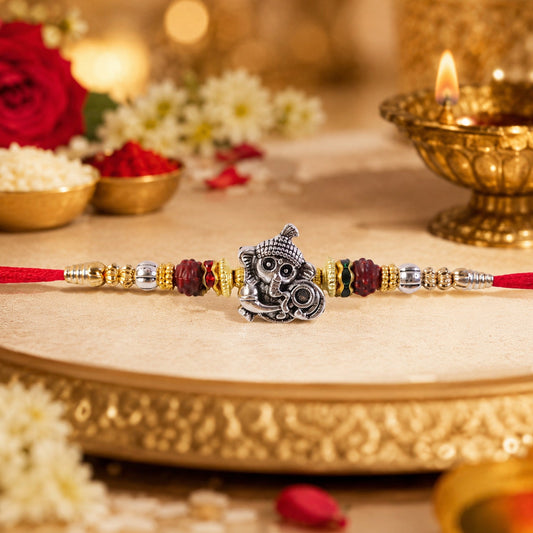 Stylish handmade silver Ganesha Rakhi with Rudraksha beads for sibling gifting