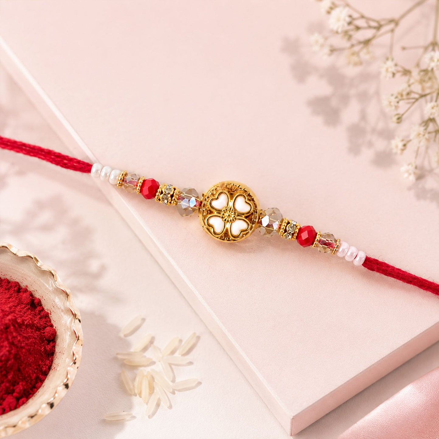 Golden Floral Cutwork Rakhi with Red Crystal Beads for Brother