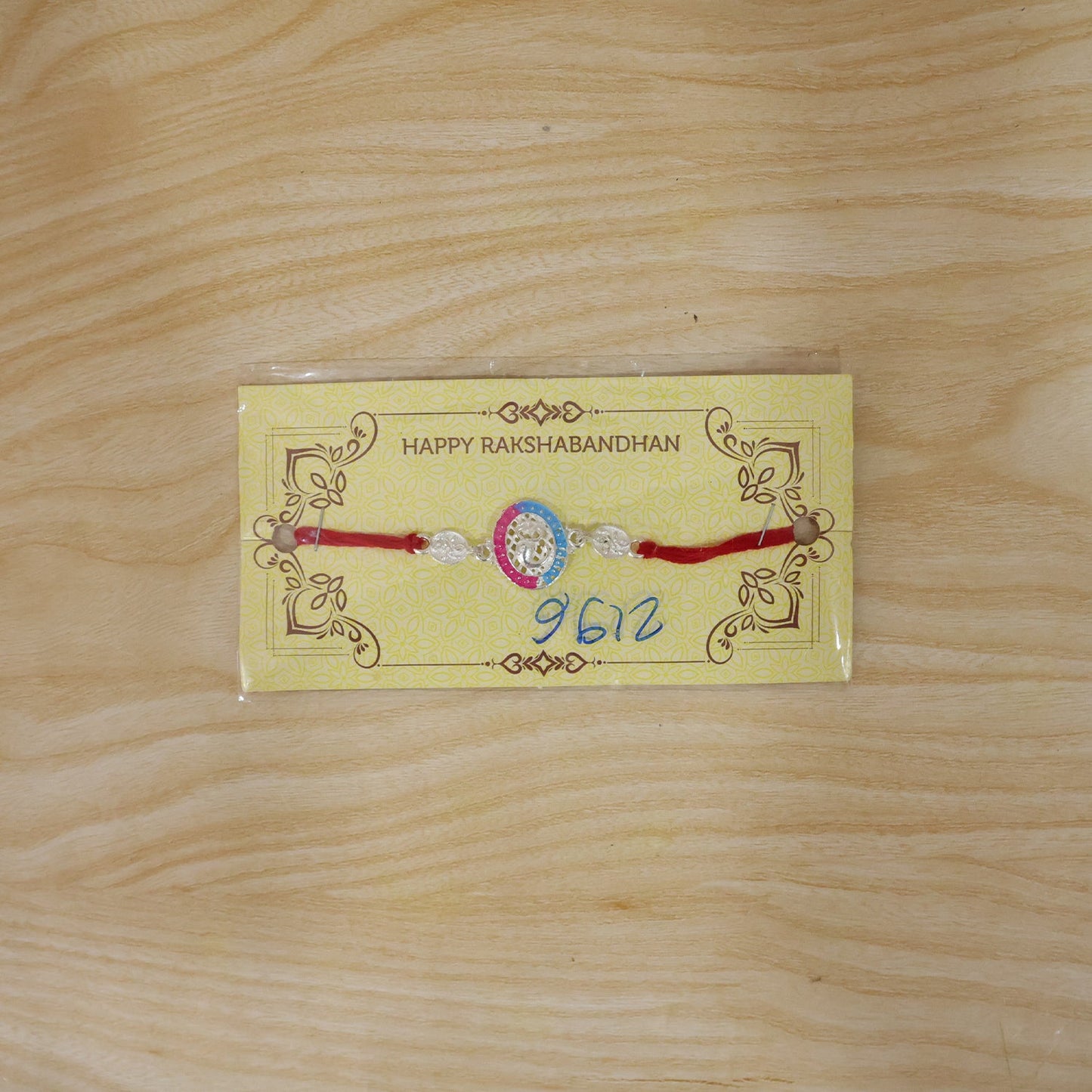 Silver Meenakari Rakhi with Pink & Blue Enamel for Brother