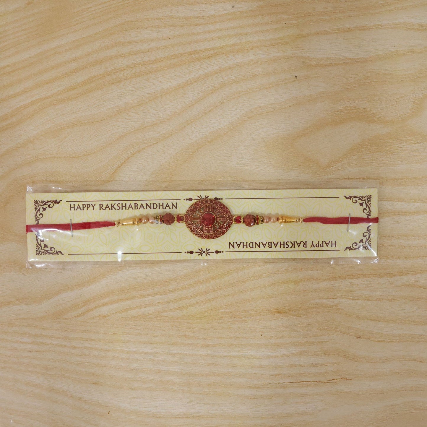 Red Crystal Floral Rakhi with Rudraksha & Pearl Beads for Brother