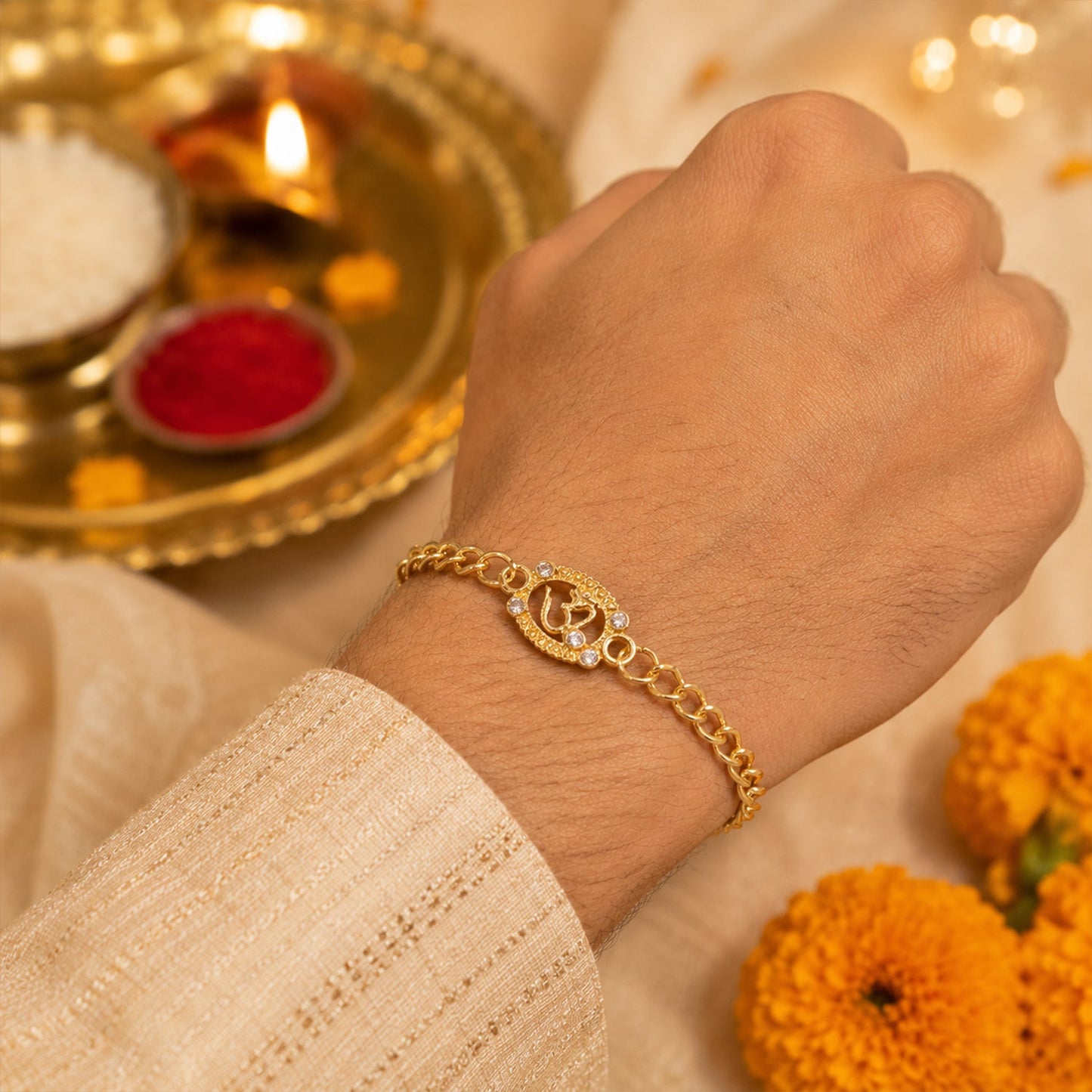 Hand wearing Om stone studded rakhi bracelet