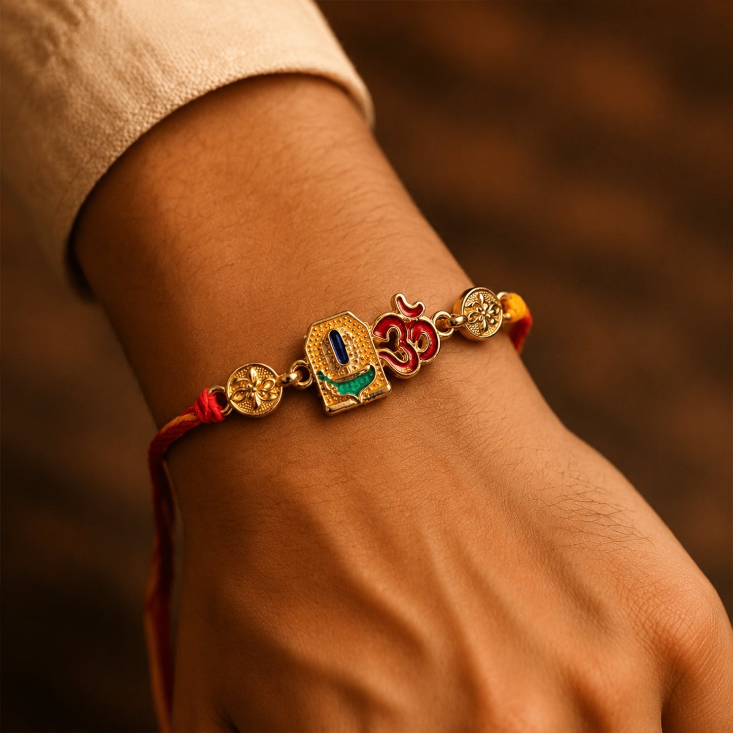 Om Blue Enamel Gold Tone Rakhi