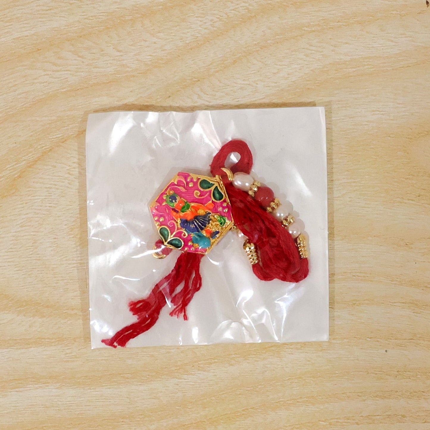 Multicolor enamel rakhi with decorative elements