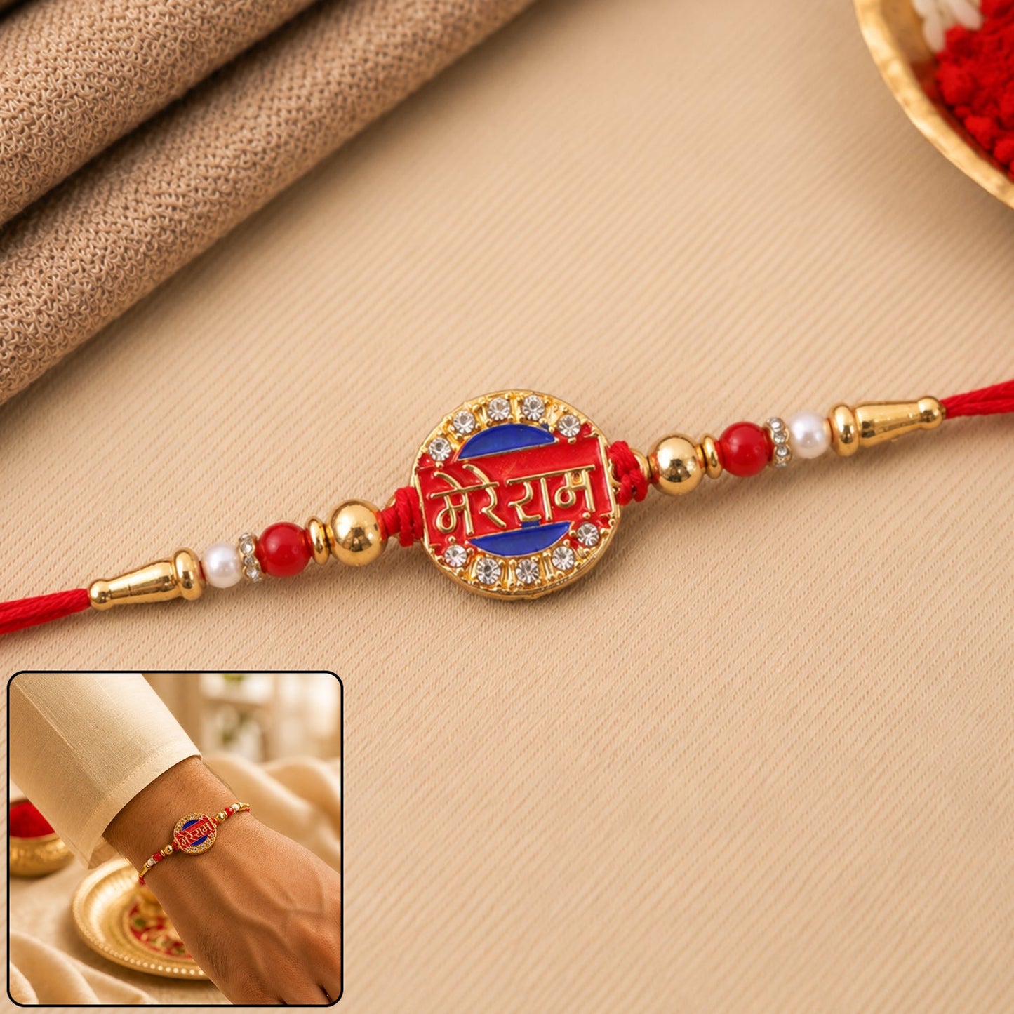 Close-up of Mere Ram Text Gold Tone Stone Studded Rakhi