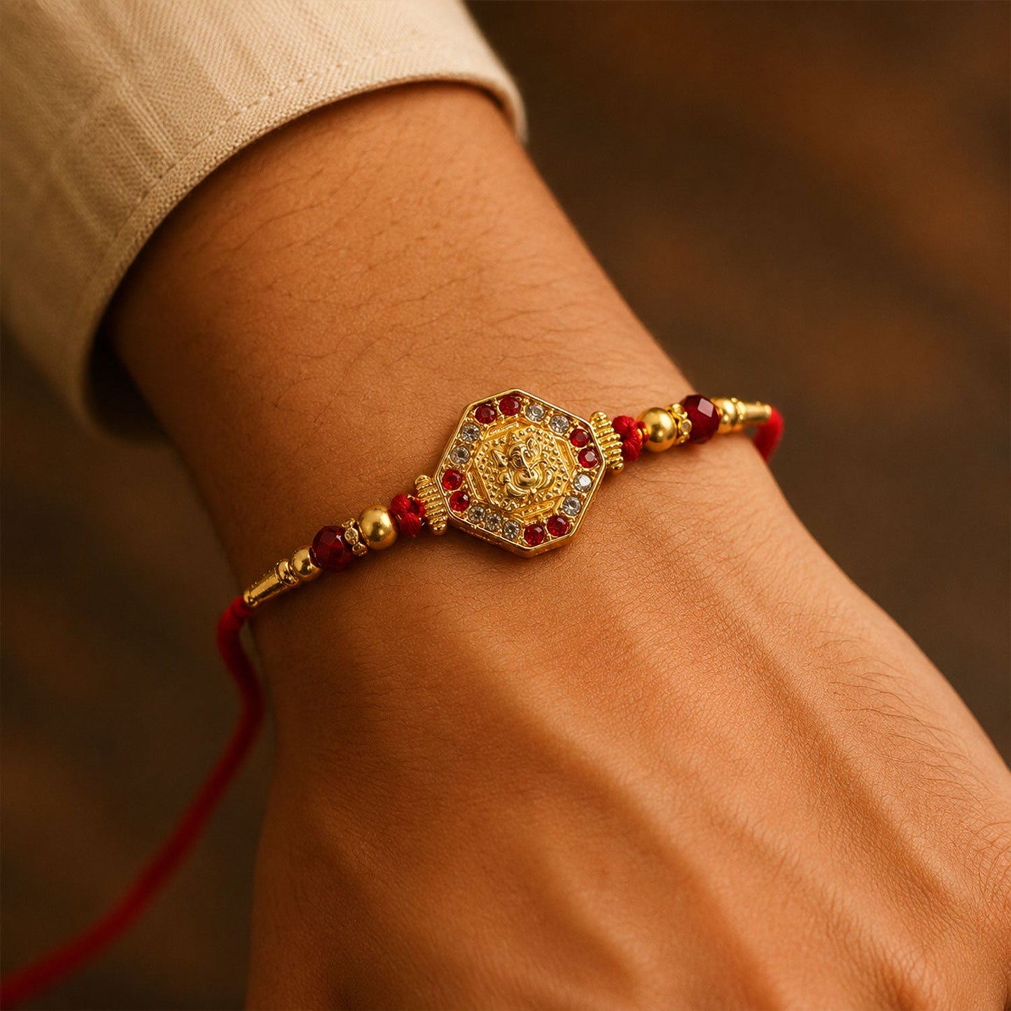 Lord Ganesha Red Enamel Gold Tone Rakhi