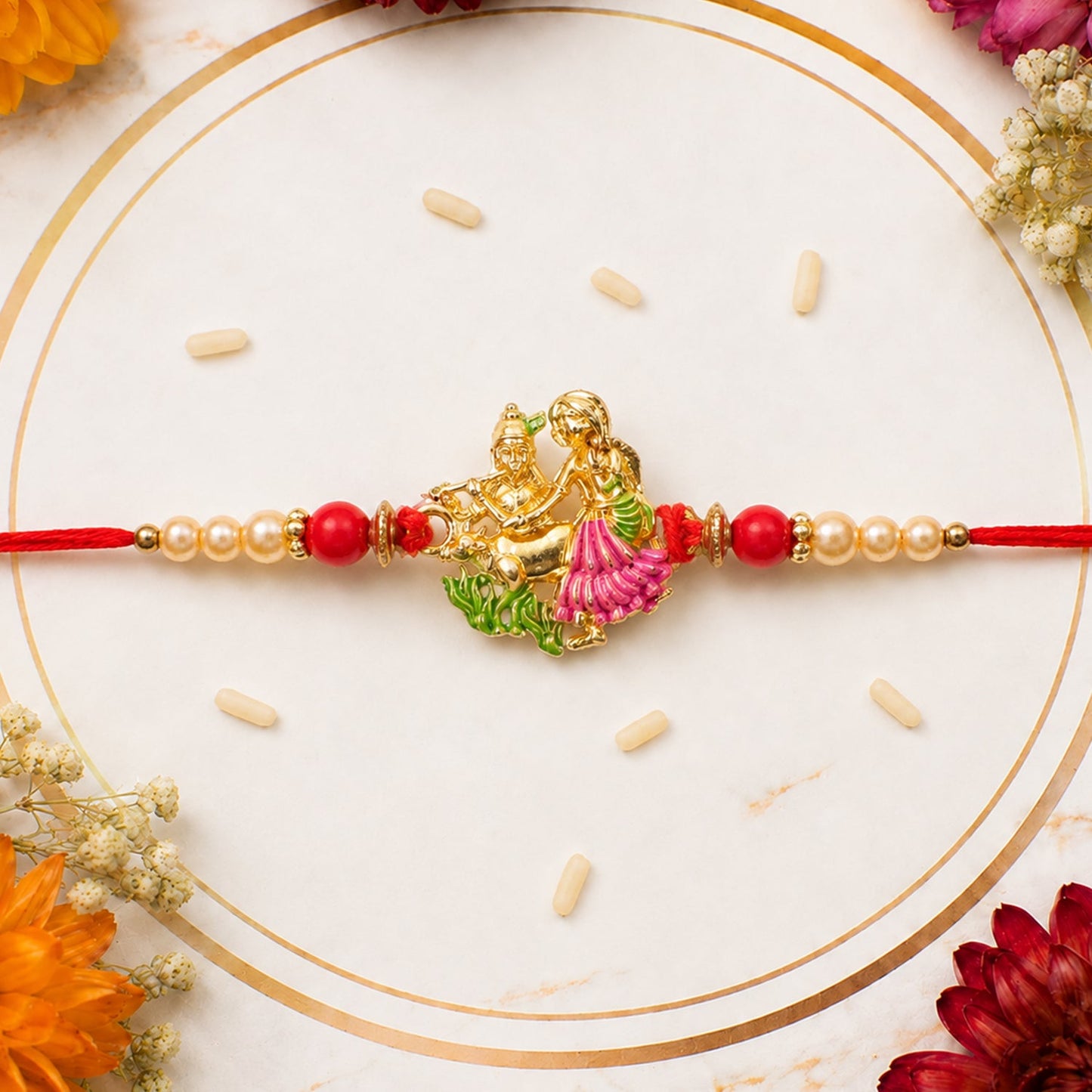 Radha Krishna rakhi with intricate pink & green enamel work