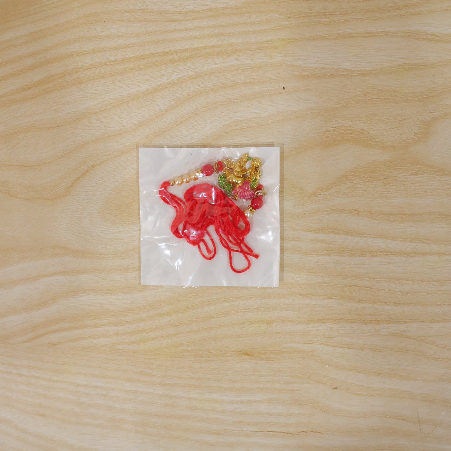 Radha Krishna rakhi displayed on a festive background