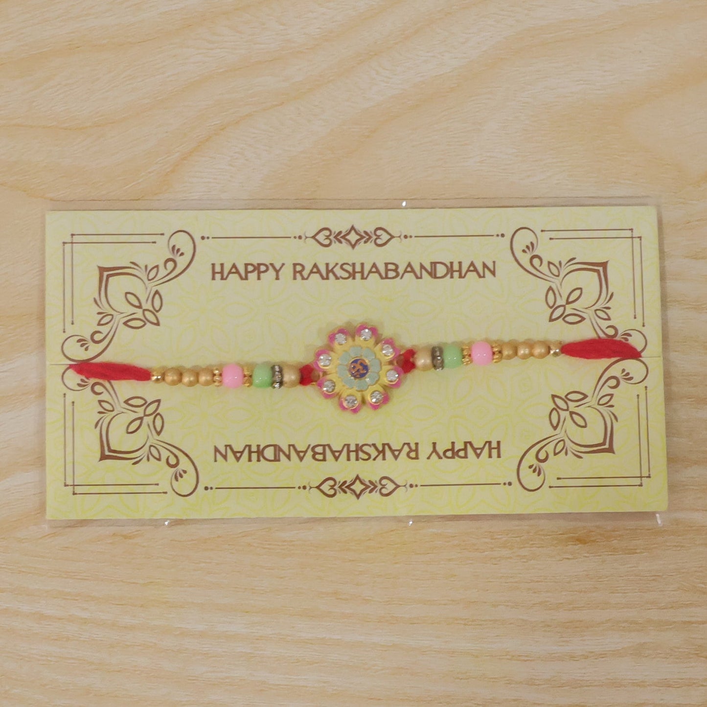Multicolor Floral Om Meenakari Rakhi with Tassel for Brother