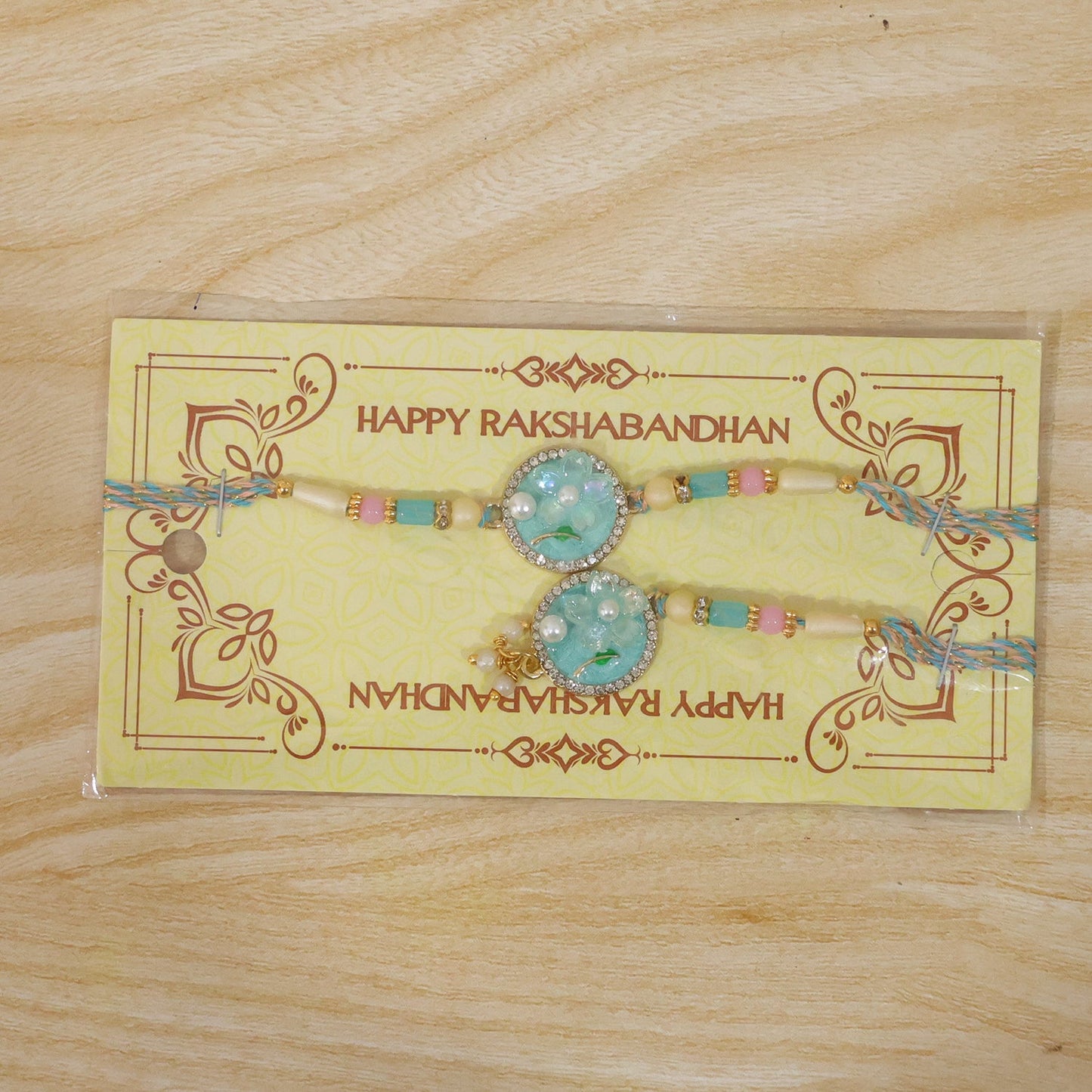 Teal Floral Bhaiya Bhabhi Lumba Rakhi with Pearl Drops