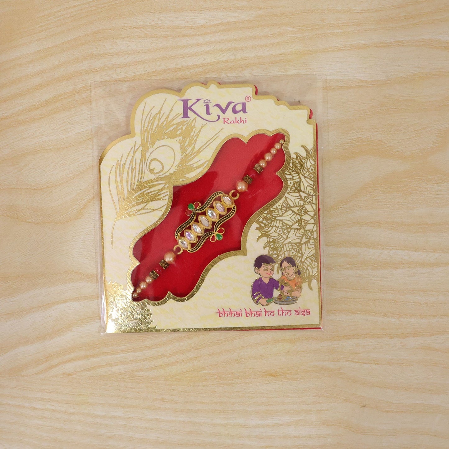 Side angle of the designer Rakhi, highlighting its studded kundan stones.