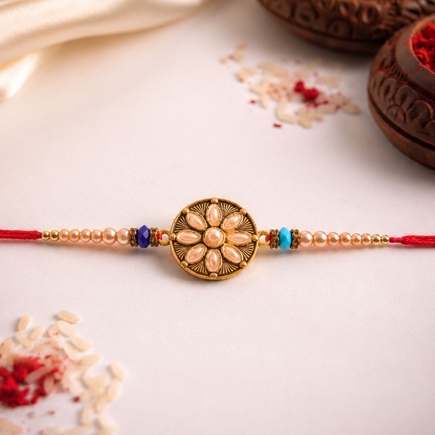 Kundan Stone Rakhi for Brother elegantly tied on a wrist for Raksha Bandhan.