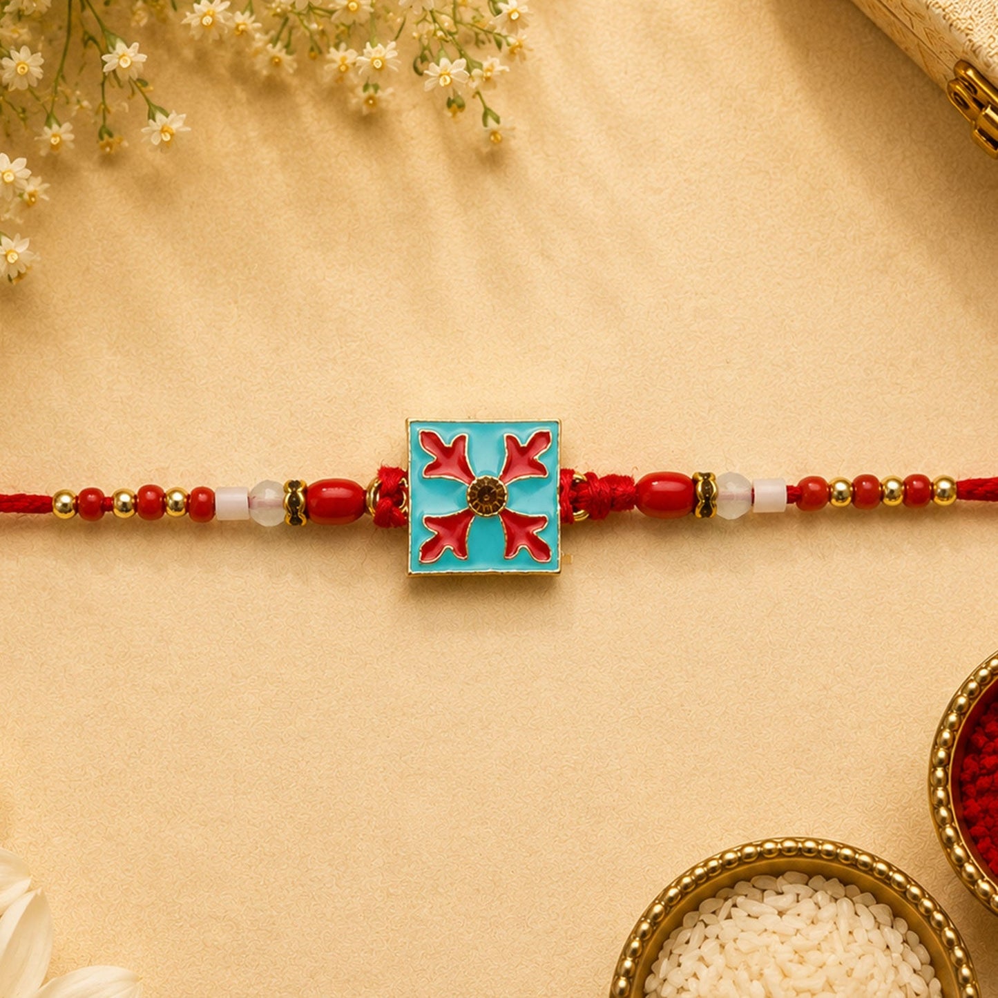 Detailed shot of the decorative beads on the Square Design Charm Kids Rakhi.