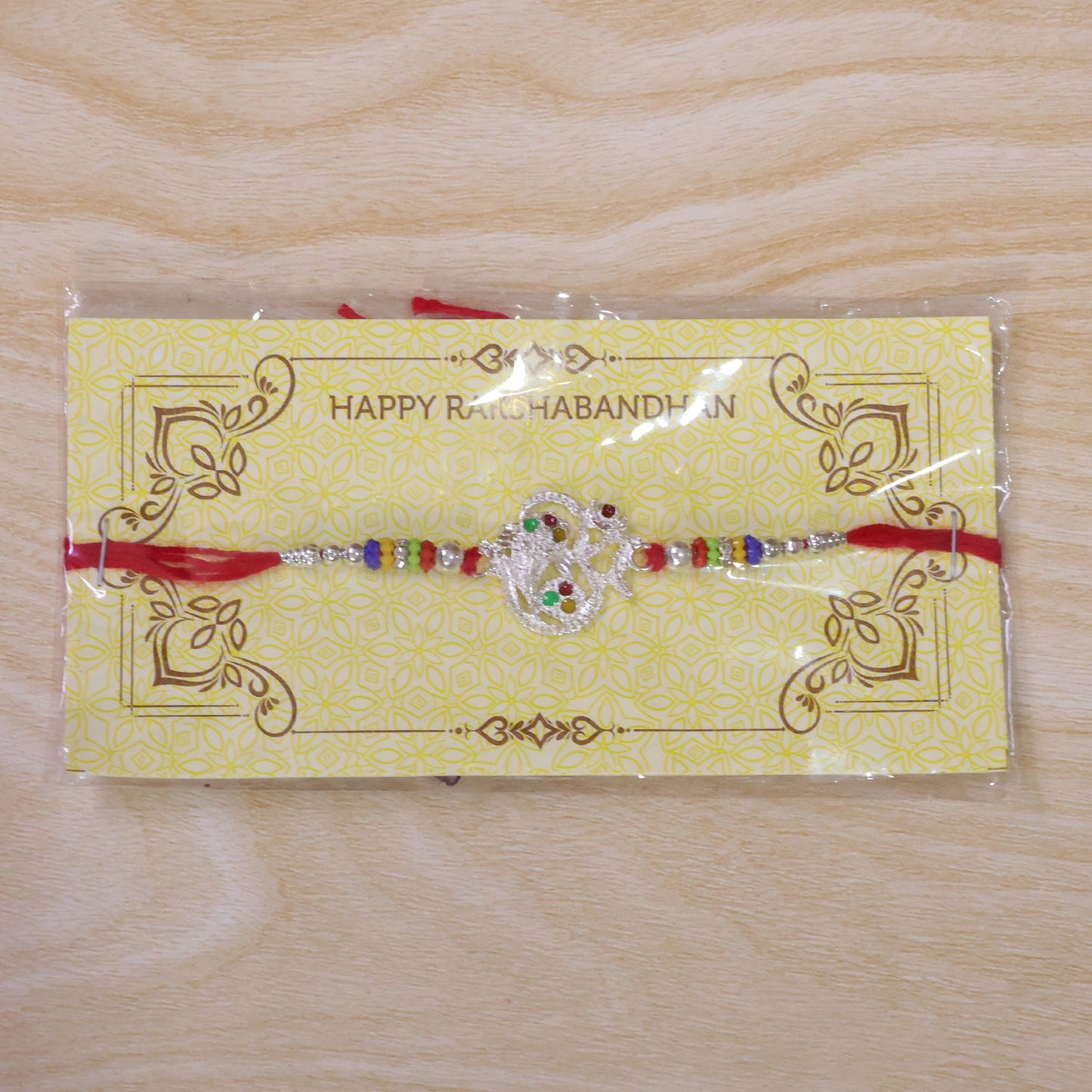 Om Design Ganesha Stone Beads Designer Rakhi For Brother