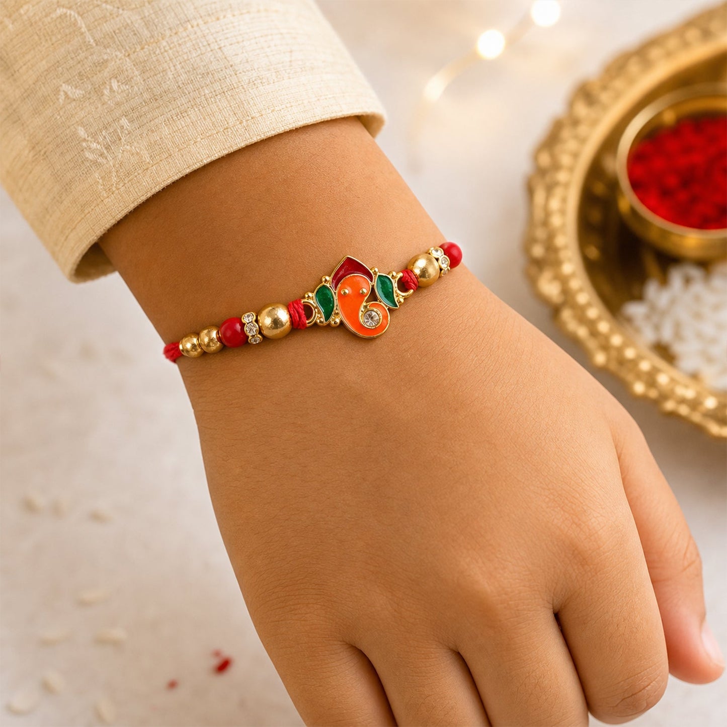 Detailed view of the beads and thread on the Ganesha Rakhi.