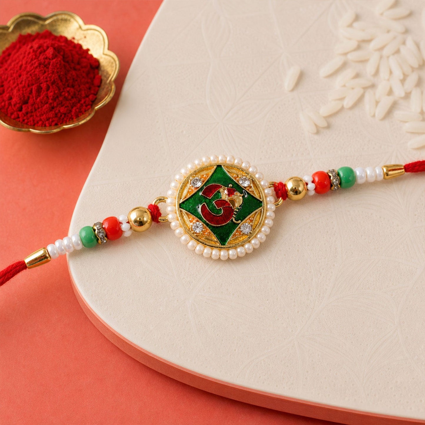 Religious Om Round Rakhi with Meenakari & Pearls – Rakhi for Brother