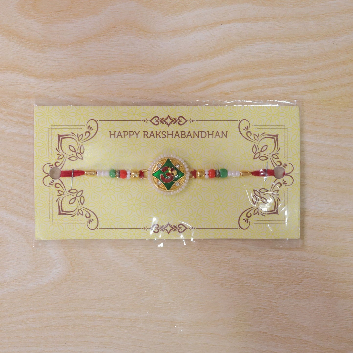 Religious Om Round Rakhi with Meenakari & Pearls – Rakhi for Brother