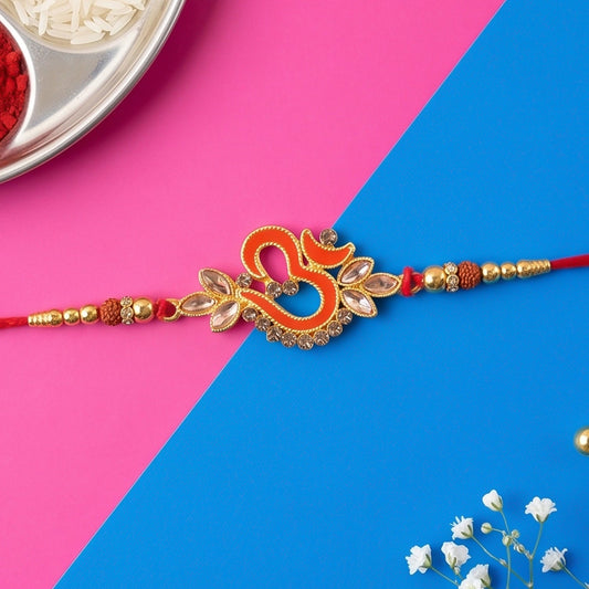 Om Symbol Stone Studded Designer Rakhi for Raksha Bandhan with a traditional red thread.