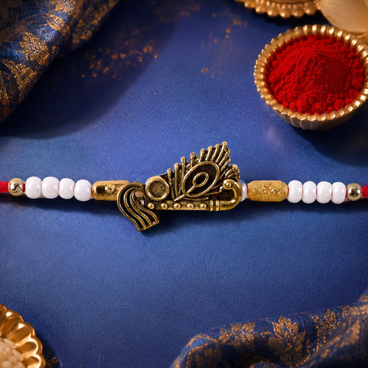 Peacock Feather Motif Designer Rakhi, a traditional gift for Raksha Bandhan, displayed on a clean background.