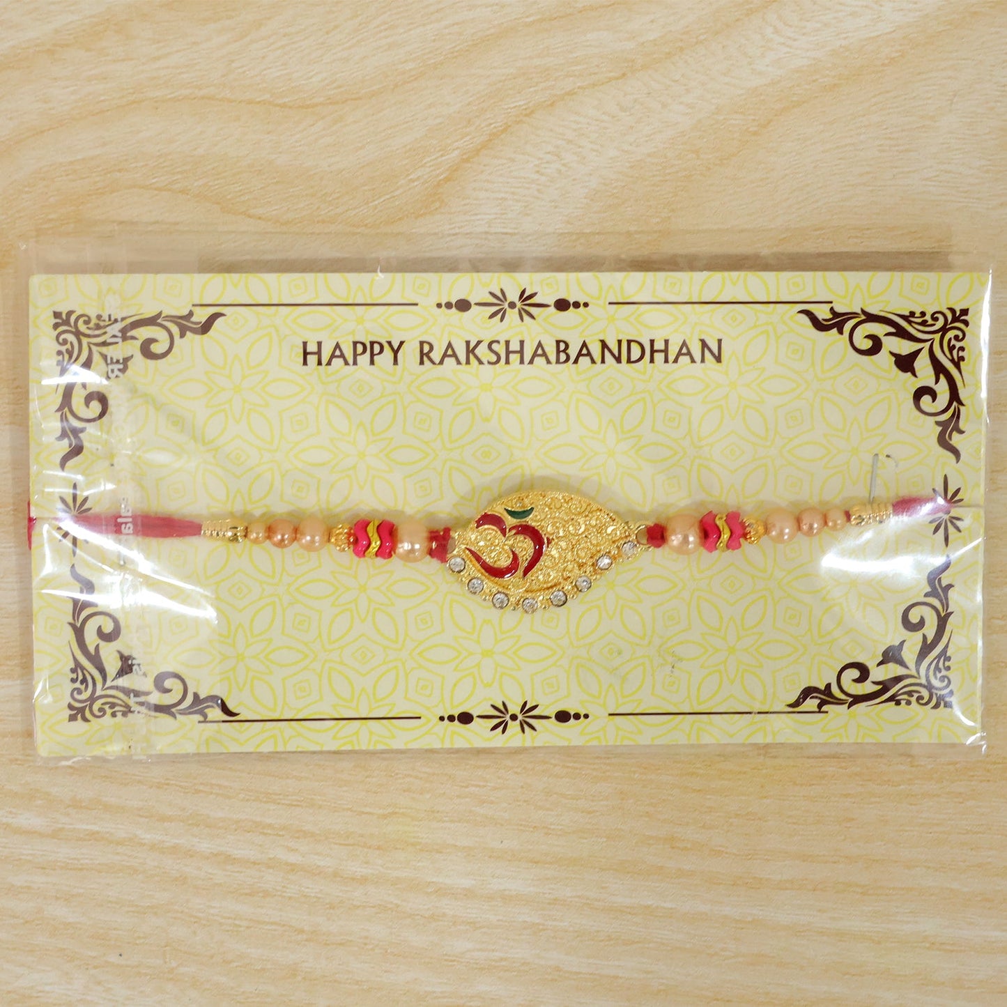 Paisley Om Stone Designer Rakhi with Pearl Beaded Festive Detail