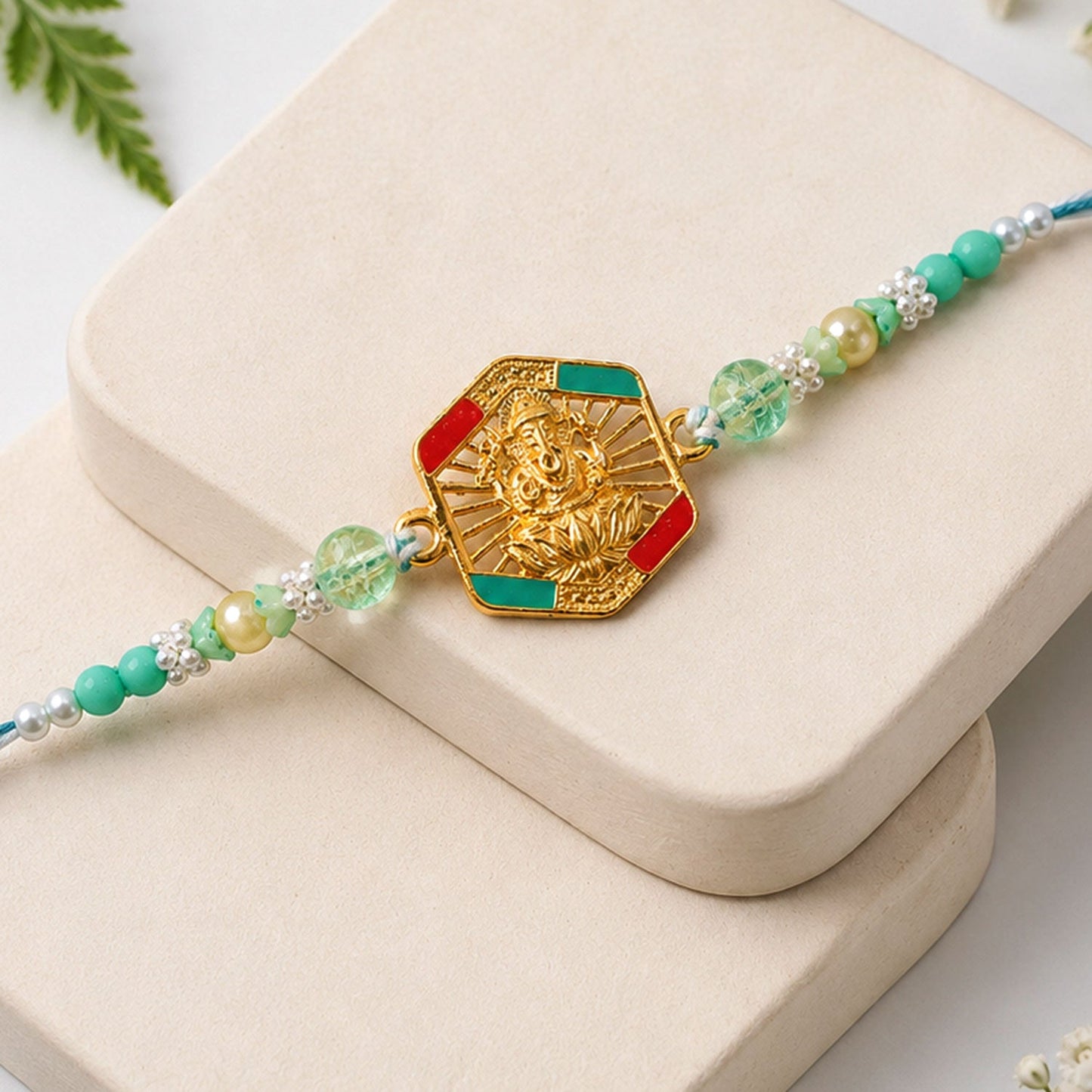 Hexagon Ganesha Designer Rakhi with Pearl Beaded Festive Detail