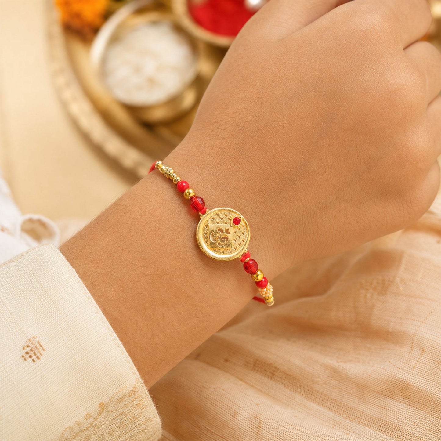 Round Om Coin Designer Rakhi with Stone Beaded Festive Detail