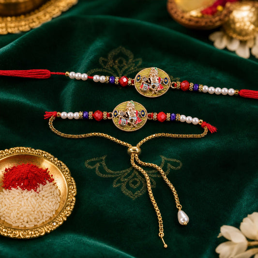 Two ornate gold-colored bracelets with Ganesha medallions, pearl beads, and red and blue accents, on a dark green velvet