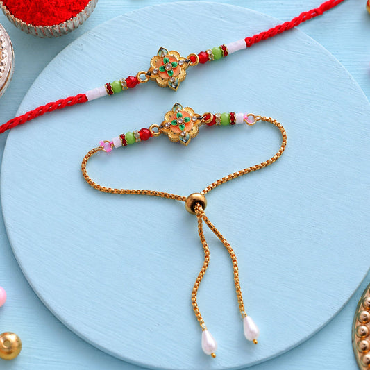 Two ornate floral bracelets, one a red thread and the other a gold chain, rest on a light blue surface.