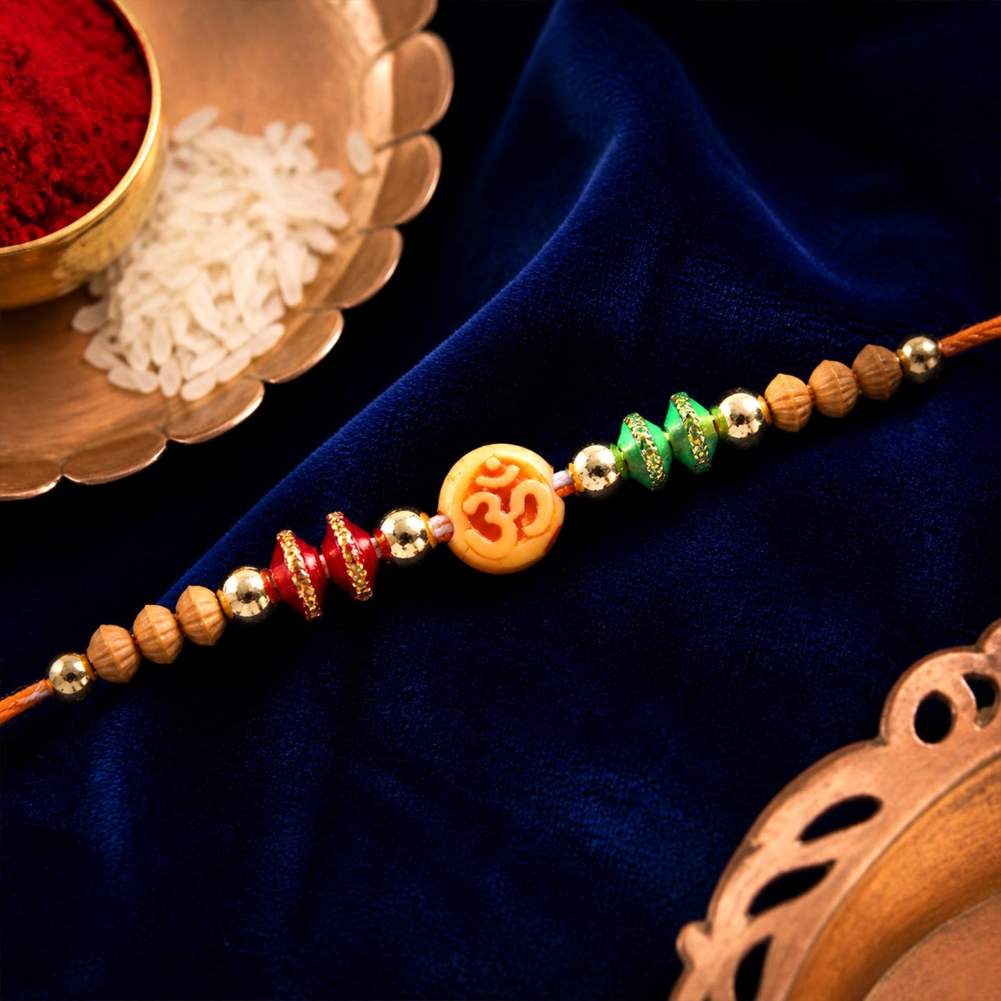 Om Motif Rakhi with Sandalwood Beads & Bead Accents