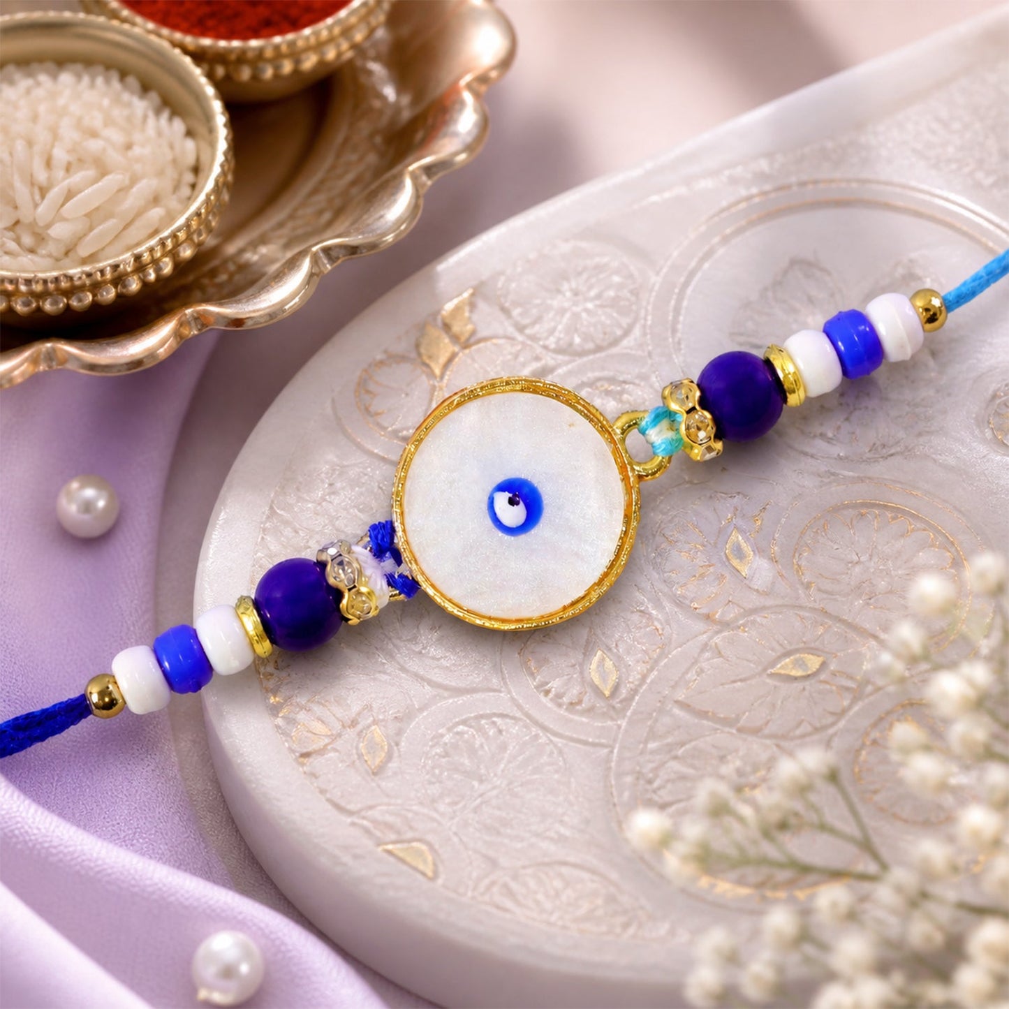 Classic Evil Eye Rakhi with Pearl Beads and Smooth Round Center Detail