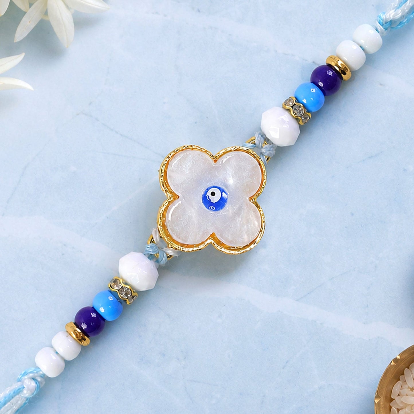 Flower Evil Eye Rakhi with Pearl Beads and Soft Petal Center Design