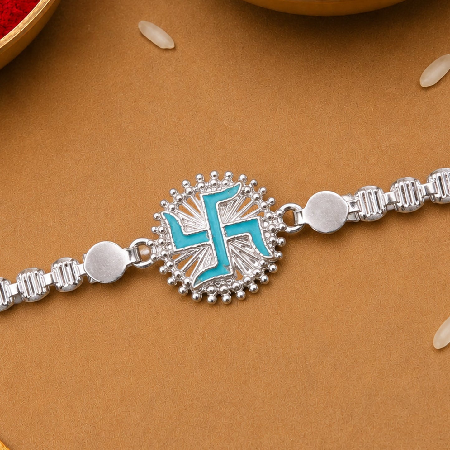 Round Silver Swastik Turquoise Enamel Studded Chain Rakhi