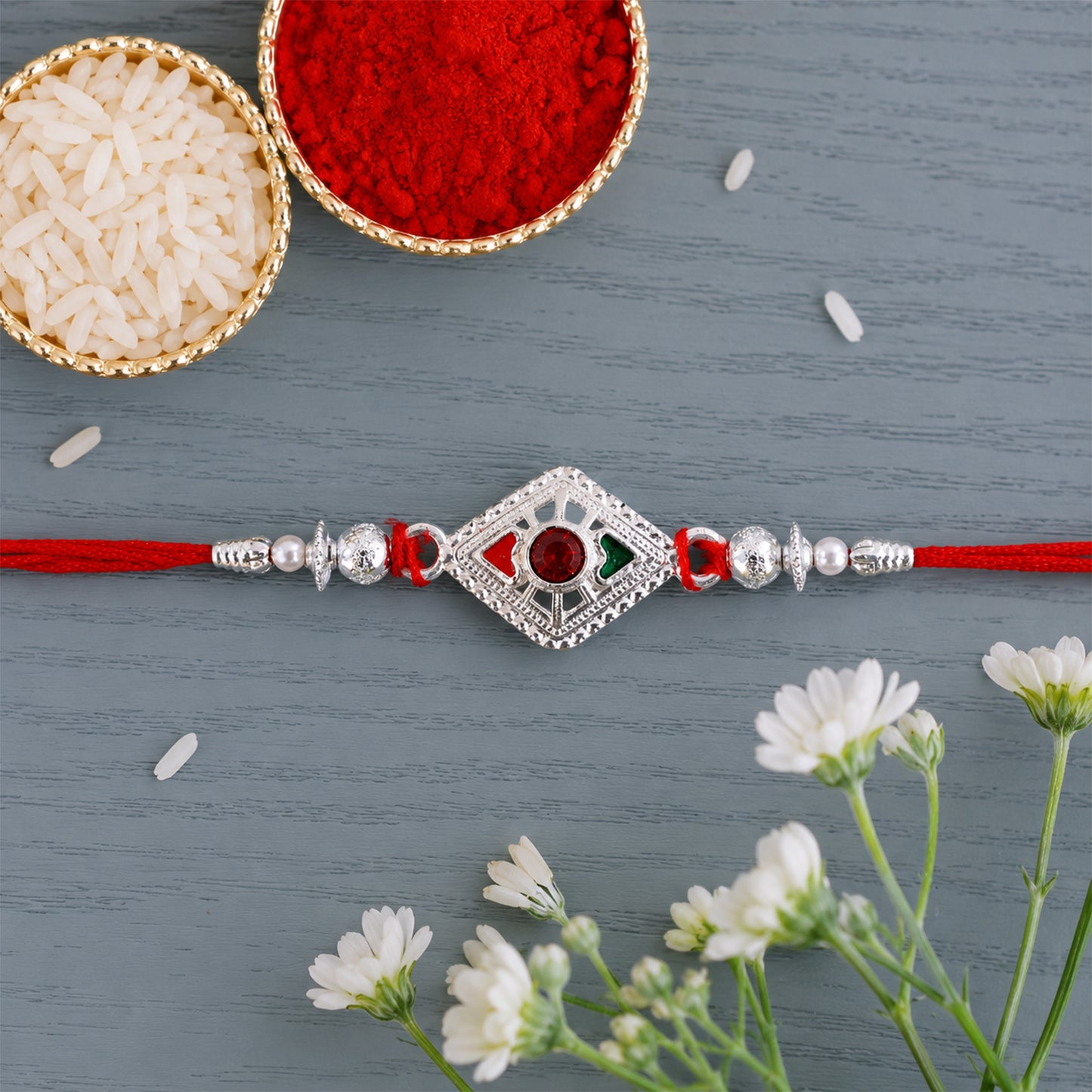 Square Silver Rakhi with Red Stone Center and Pearl Bead Chain