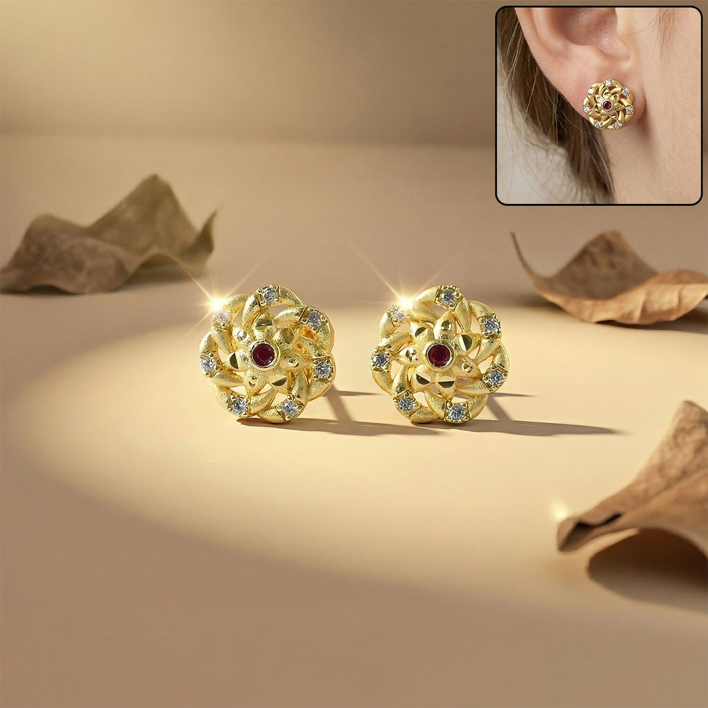 Close-up of gold floral cluster stud earrings adorned with sparkling stones