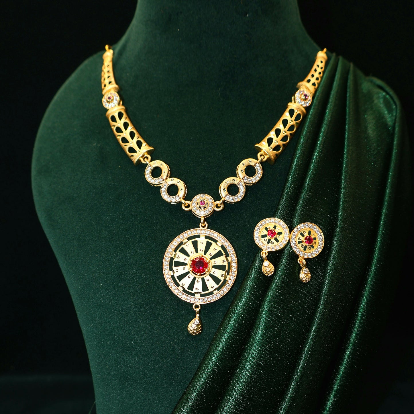Gold Plated Round Pendant Forming Necklace Set with Ruby Stone & AD Detailing