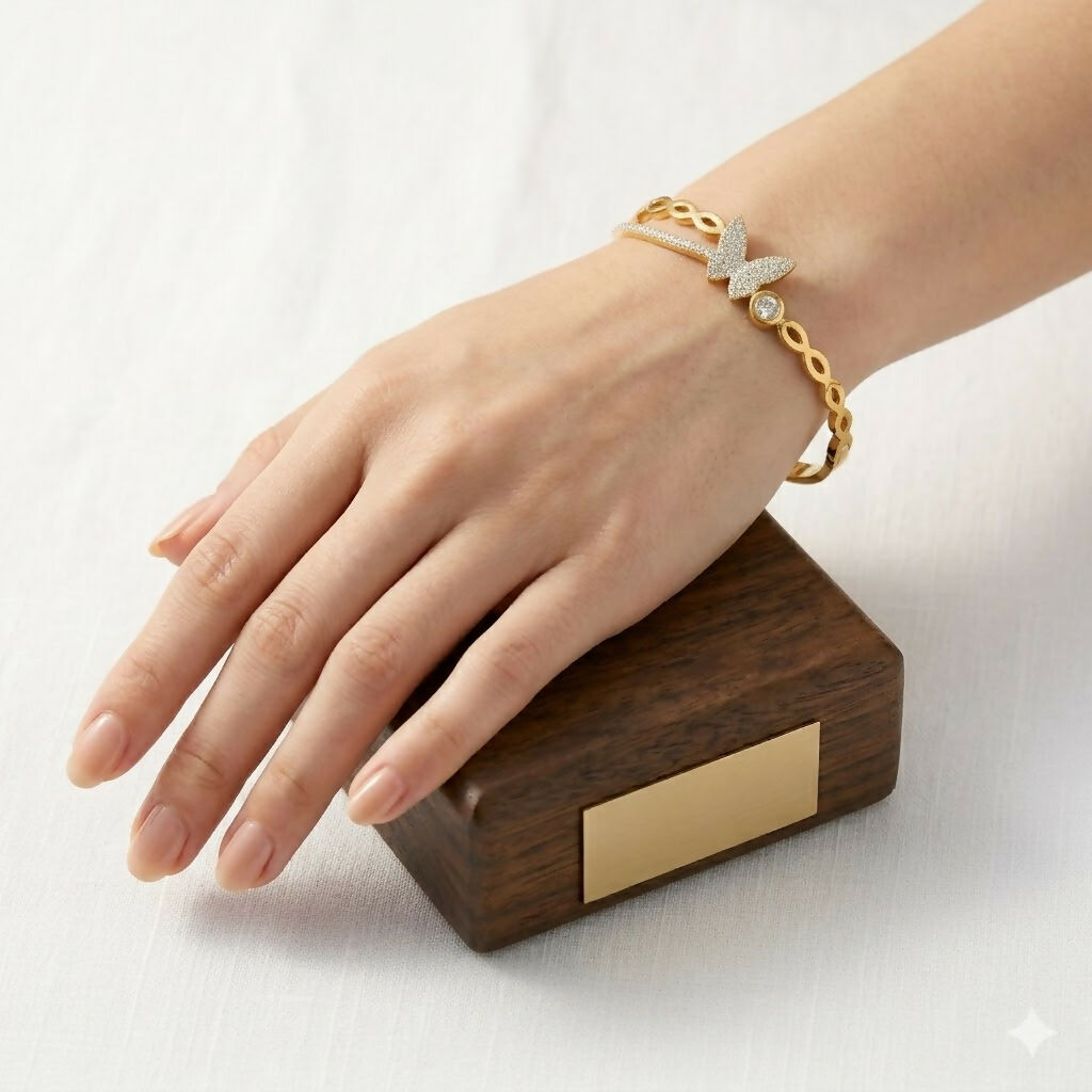 Side view of linked flower segments on botanical kada bracelet