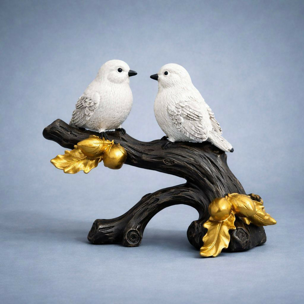 Decorative bird couple figurine displayed on shelf