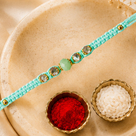 Pearl and Stone Rakhi with bright beads on a white background.