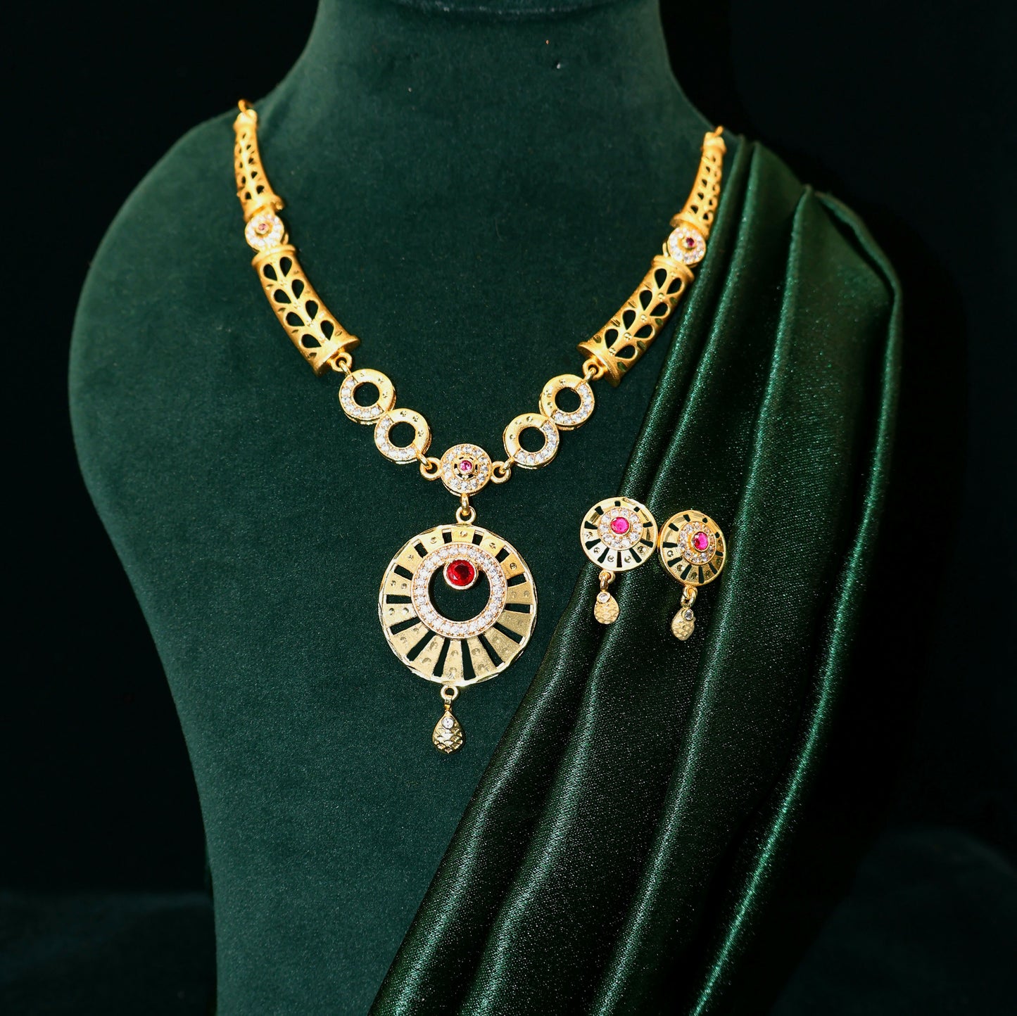 Full view of gold plated round pendant necklace and earrings set