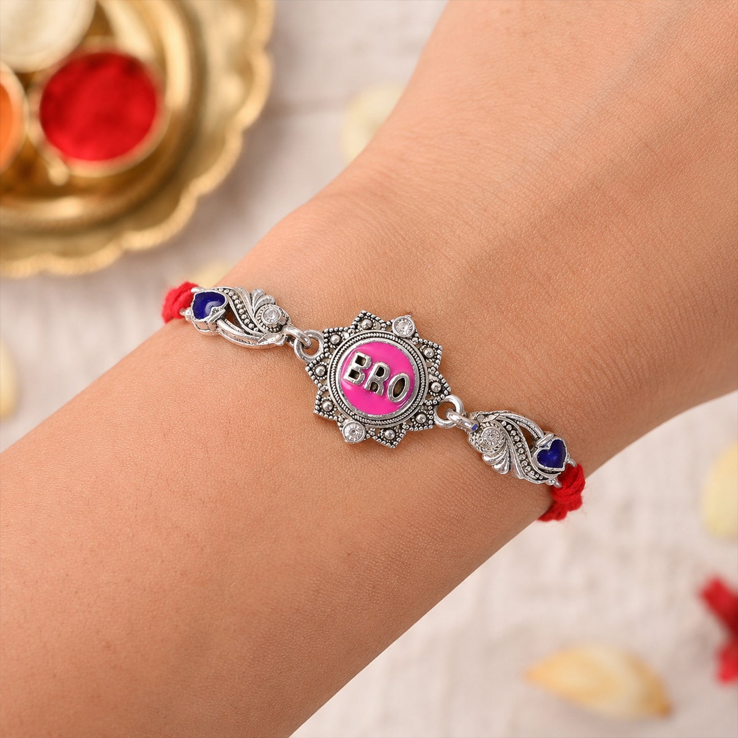 Silver-Toned BRO Rakhi with Pink Enamel, Blue Heart Accents, Crystals & Red Thread