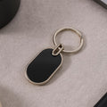 Oval Metal Keychain – Elegant Black & Silver Finish for Everyday Use