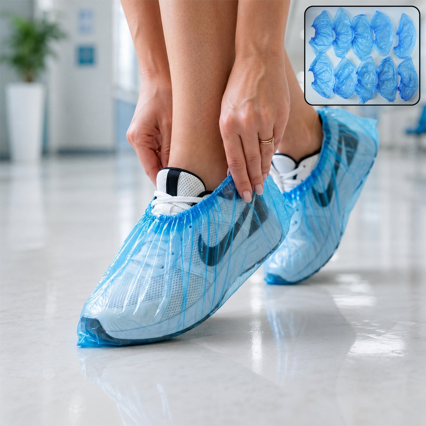 Disposable plastic shoe covers protecting shoes in use
